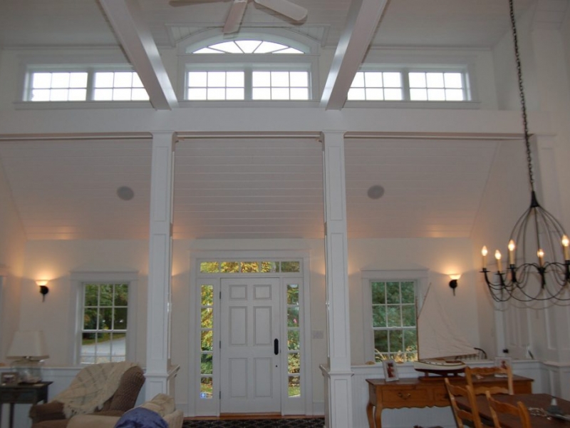 Interior front entry with cathedral ceiling, second floor windows and exposed beams