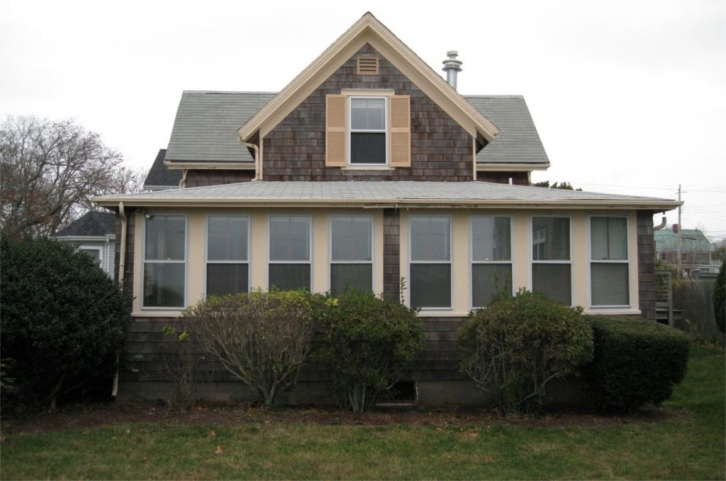 Small dark house in Falmouth before remodeling by Lagadinos Building and Design