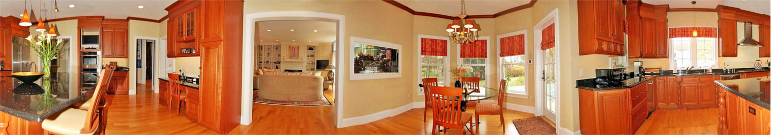 Panoramic image of kitchen and dining area of new home in Mashpee Cape Cod